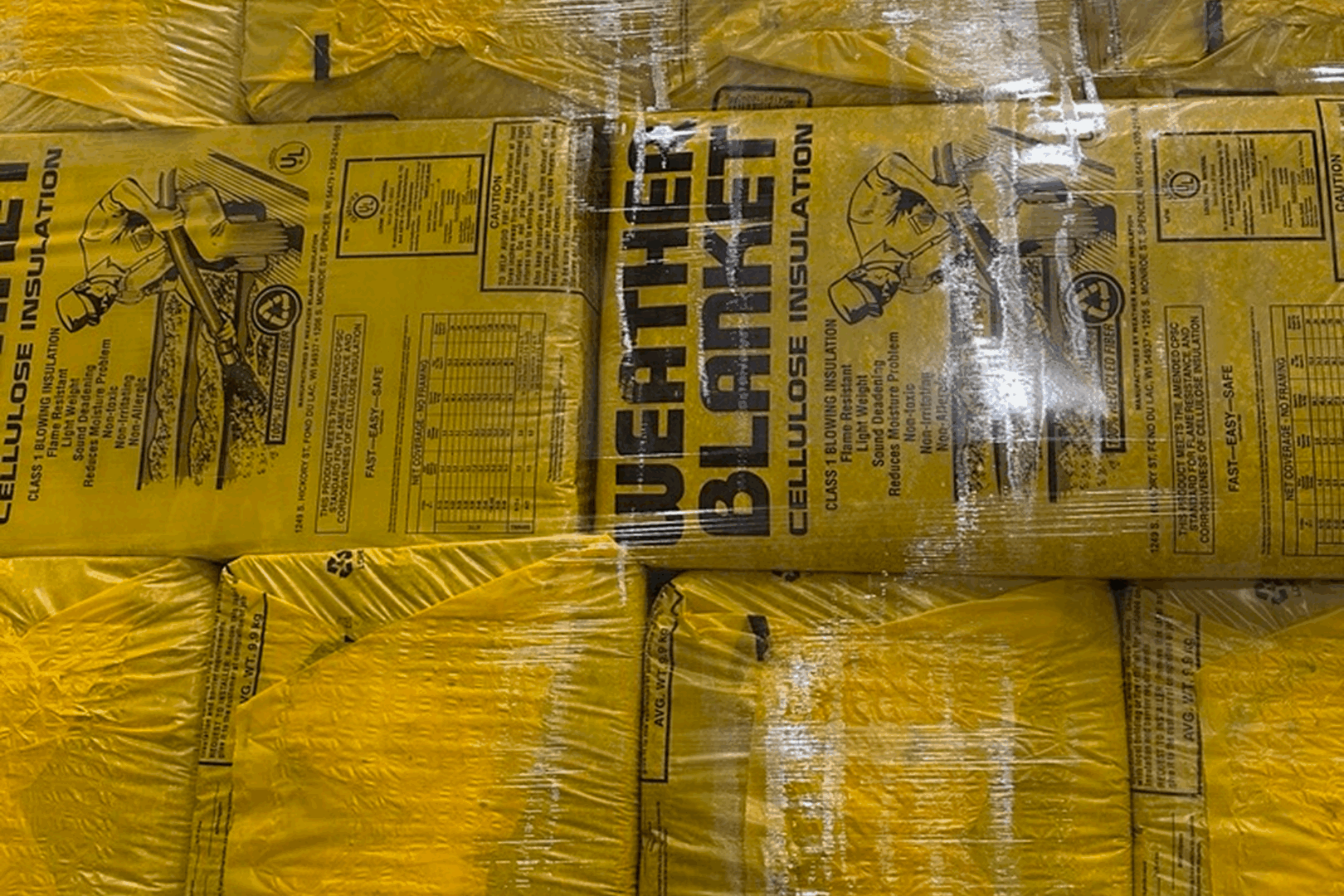Stacked insulation packages in yellow wrapping