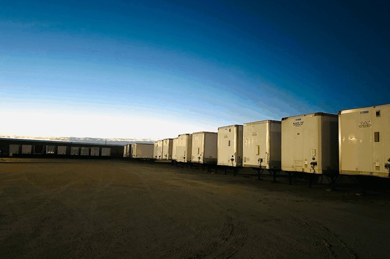 Trailers lined up at sunset